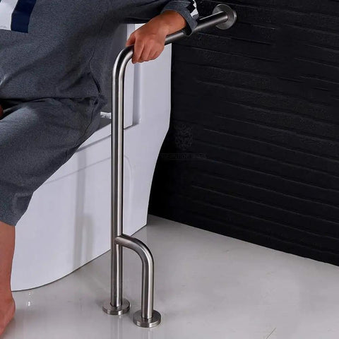 Heavy Duty Toilet Safety Rail 27.5 Inch Bathroom Grab Bar Featuring Brushed Stainless Steel Build used for support near a toilet.