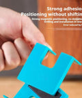 Close-up of blue Magnetic Hinge Guide Kit For No Drill Needed Quick Door And Cabinet Installations in hand showing features.