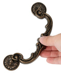 Rock Solid Heavy Duty Zinc Alloy Drop Bail Drawer Pulls In Slick Antique Bronze Finish Badass Rated For Kitchens And Dressers With Six Inch Center Spacing Easy Clean Rust Proof Cabinet Hardware Set Of Eight, showing ornate handle design.