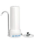 Countertop Drinking Water Filter System For City Water, Lightweight Portable Unit That Reduces Chlorine, Sediment, Lead And Odor, Delivers 99% Aesthetic Chlorine Reduction With Up To 6,000 Gallons, No Installation, Model CT1000, shown in white with faucet and hose on a countertop.