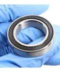 Nasty Smooth Hybrid Ceramic Ball Bearings With Rock Solid 440C Stainless Steel Rings For S6804 S6805 S6806 Models shown in hand.