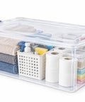 Ginormous 105 Quart Clear Storage Bin With Blue Secure Latch Heavy Duty Plastic Tote For Bulky Seasonal Gear And Bedding Keeps Your Space Spiffy And Makes Organization A Breeze filled with towels and cleaning supplies.