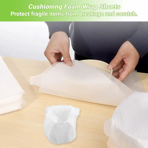 Kickass Packing Supplies Bundle Featuring Thick Foam Wrap Roll And Dense Cushion Mats For Smooth Sailing And No Damage Hauling On Large Household Moves, cushioning foam wrap sheets being used to protect fragile items.