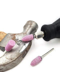 Rotary Tool Grinding Stone Set With One Eighth Inch Shank Aluminum Oxide Bits, 100 Pcs in use on a metal hammer.