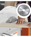 Badass Mini Table Saw Station Built For Road Ready Woodworkers Featuring A Slick Flip Jig Base and a sharp blade cutting a wooden plank.