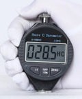 Hella Accurate Digital Shore Hardness Tester Type A Durometer For Rubber Plastic And Foam showing 028.5 HC reading in hand.