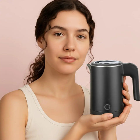 Woman holding 0.5L Portable Electric Kettle For Travel And Office Stainless Steel Mini Tea And Coffee Kettle Hot Water Boiler, black