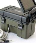 Rock Solid 12V Solar Auxiliary Power Pack For Trail Cameras With Weather Resistant Housing in black with solar panel and charging cable.