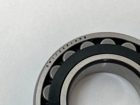 Close-up of Heavy Duty Spherical Roller Bearing 22209ES TVPB W33 with polyamide cage and Switzerland engraving.