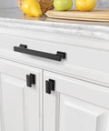 Front view of 10 Pack 5 Inch Matte Black Cabinet Handles for kitchen cabinets and drawers, installed on white cabinetry.