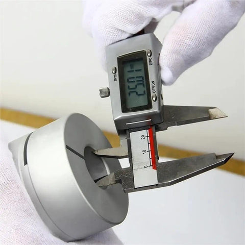 Digital caliper measuring a 35X50mm Alloy Jaw Flexible Shaft Coupler Bad Boy Elastic Motor Coupler for CNC applications.