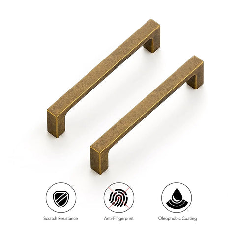 Built Tough Vintage Style Antiqued Brass Cabinet Handles Featuring Dead Nuts Solid Square Bar Pulls For Heavy Duty Kitchen Drawers And Cabinet Doors Four Inch Spacing Five Pack Set close up of two antique brass bar handles.