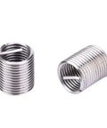 Close-up of two stainless steel inserts from M12x1.5 Thread Insert Kit Stainless Steel 17 Piece Set For High Voltage Switchgear Repair