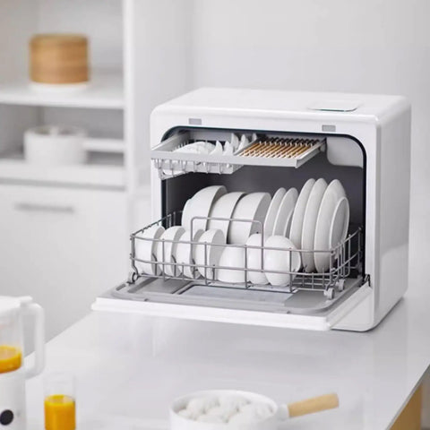 Portable Countertop Dishwasher Fully Automatic Compact Kitchen Essential With Intelligent Air Dry and Spacious Rollout Basket For Tiny Homes Ditch The Sink Grime Quick Cleanup Perfection with clean white dishes inside.