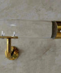Straight Up Heavy Duty Clear Acrylic Stair Handrail With Solid Gold Wall Mount Brackets showing wall mount detail.