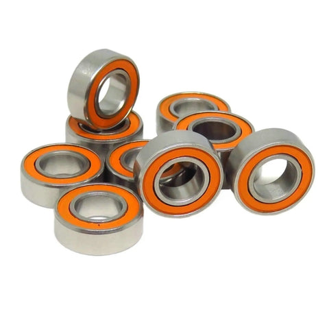 One Hundred Forty Piece Hardcore Hybrid Ceramic Bearing Set Featuring Slick Stainless Steel Balls For Ultra Low Friction Spin In Bikes And Motor Parts, showing eight bearings with orange rings.