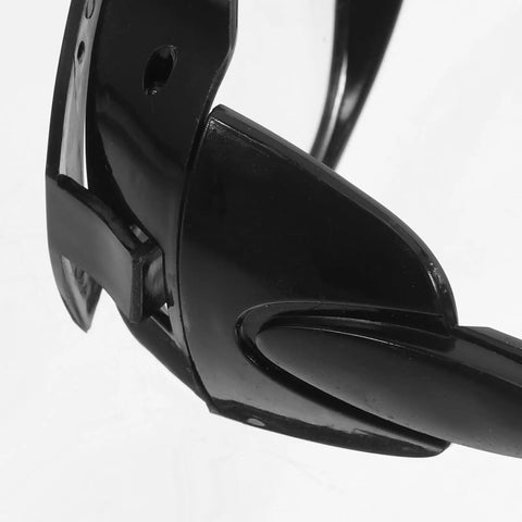Close-up of Built Dog Gone Tough 6-Pack Welding Goggles featuring shatterproof black plastic frame for reliable eye protection.