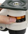 Close-up of a hand adjusting a Four Piece Leveling Casters For Workbenches With Nylon Wheels And Rubber Feet Retractable Caster Set