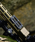 Arca Dovetail Rail For M-LOK System Quick Release Tripod Mount Adapter Built For Arca-Swiss And RRS Standards attached on rifle.