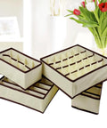 Top Tier Nonwoven Bra And Underwear Storage Boxes Four Piece Set ideal closet drawer organizer for women in soft beige.