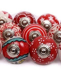 Game Changer Set Of 10 Hand Painted Red And White Ceramic Cabinet Knobs Drawer Pulls Decorative kitchen cupboard handles displayed together.