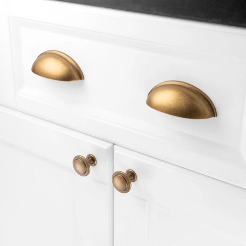 Old School Cool Heavy Duty 10 Pack 3 Inch Cabinet Pulls Antique Brass Vintage Hardware on white cabinet drawers.
