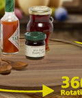 Smooth As Butter 14 Inch Solid Acacia Wood Lazy Susan Rotating Turntable Locks with sauces and jams on a rotating tray.