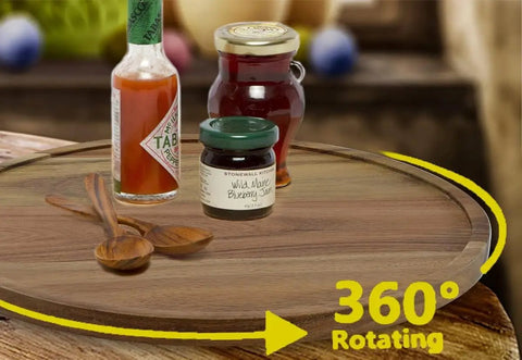 Smooth As Butter 14 Inch Solid Acacia Wood Lazy Susan Rotating Turntable Locks with sauces and jams on a rotating tray.