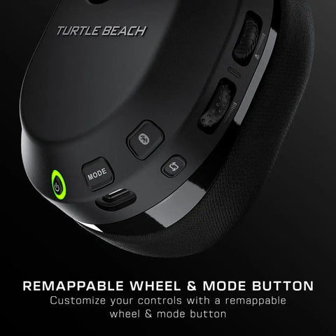 Close-up of Stealth 600 Wireless Multiplatform Gaming Headset buttons showing remappable wheel, mode button, and text