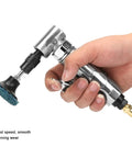 Image of a hand holding a 90 Degree Pneumatic Angle Die Grinder cranking at 20000 RPM with a 2 inch grinding disc for precision work.