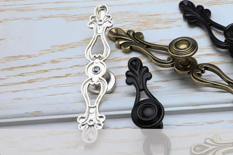 Six Piece Rock Solid Vintage Zinc Alloy Cabinet Handles And Dresser Drawer Pulls With Rust Proof Heavy Duty Hardware Kit For Smooth Wardrobe Cupboard Home Project displayed on a wooden surface.