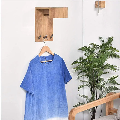 Heavy Duty Solid Wood Wall Mounted Coat Rack With Reinforced Metal Hooks showing blue shirt and plants, practical entryway organizer.