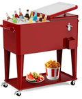 80 Quart Rolling Ice Chest Cart Portable Beverage Cooler With Bottle Opener Cap Collector And Storage Shelf For Patio Parties BBQs And Beach Days Go To Party Essential Outdoor Fun Red filled with bottles and food on shelf.