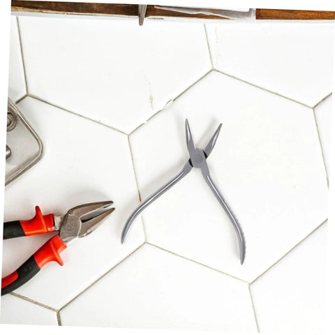 Stainless Steel Eyeglasses Repair Tool With Angled Pliers for Adjusting Frames on tiled surface
