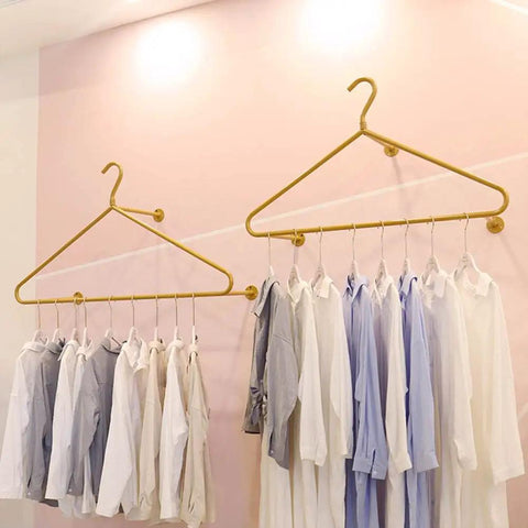 Score This Premium Wall Mount Clothes Rack With Heavy Duty Steel Shelves And Heart Shaped Design To Level Up Your Boutique Floor Or Cozy Apartment Vibe, gold hangers with shirts.