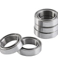 Smooth As Butter 10Pcs 10X15X4MM Double Shielded 6700ZZ Thin Bearings stacked and laid out for skateboards and motors.