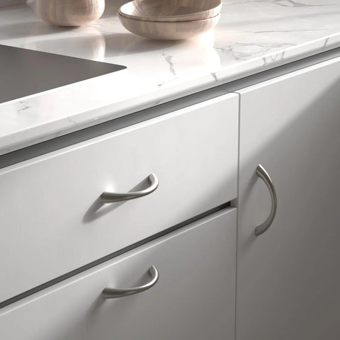 Curved Cabinet Handles Set of 10 Solid Zinc Alloy Brushed Nickel Drawer Pulls 5 Inch Center to Center installed on white cabinets