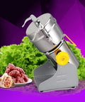Swing Type Electric Grain Mill Grinder For Home And Commercial Use with metal body and yellow dial next to fresh ingredients