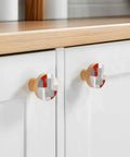 Top Shelf 2 Piece Cabinet Knobs Featuring Sleek Abstract Graffiti Prints In Bold Red And Charcoal Grey Solid Beech Wood Drawer Pulls For Kitchen Cupboard Doors Smooth To The Touch With Killer Durability And Pure Dope Style on white cabinets.