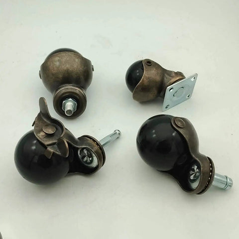 Heavy Duty Furniture Caster Wheels With Secure Swivel Stem Brakes And Vintage Steel Frames For Tables Cabinets And Dressers Floor Saving Polyurethane Rollers That Glide Like A Dream Set Of Four, showing antique brass and black ball casters.