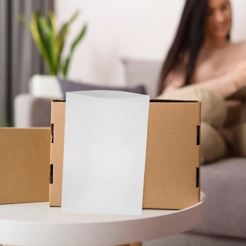 Straight Up Epe Foam Expandable Packing Sleeves In A 100 Piece Lot on a cardboard box for packing delicate items.