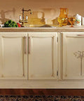 Kitchen cabinet with Six Pack 3 Inch Hole Center Antique Copper Zinc Alloy Cabinet Pulls for drawers and doors, beige finish.