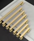 Ten Pack Slick Brushed Gold Cabinet Pulls With No Stress Install And Heavy Duty Hardware For Kitchen Drawers And Cupboards In A Fresh Nine Inch Cut displayed on a surface.
