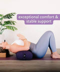 Beefy Rectangular Yoga Bolster For Deep Restorative Poses Ultra Firm Foam Core With Cotton Cover Handmade In The USA Black 25 In By 11 In By 5 In 5 Lb Restorative Pillow You Can Count On. Woman using black rectangular yoga bolster for deep restorative pose