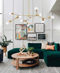 Gold 9 Light Sputnik Chandelier Modern Metal Ceiling Hanging Light Adjustable Pendant Fixture in living room with green sofa.