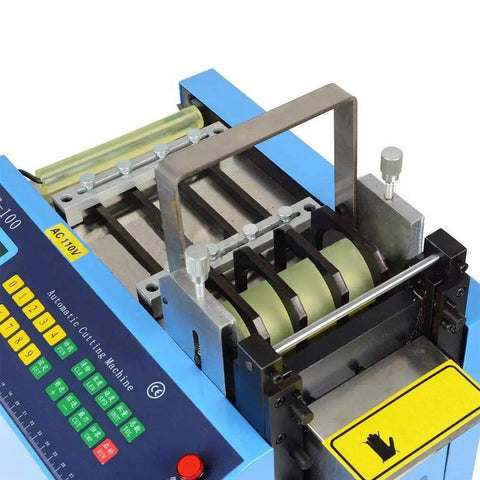 Close-up of Automatic Heat Shrink Tube And Cable Cutting Machine With Programmable Digital Controls, showing cutting mechanism and controls.