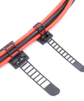 Adjustable Nylon Cable Ties Set With Self Adhesive Pads, 50 Pack In Two Sizes, securing red and black cables with zipper design clamps.