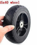 Hand holding 6 Inch Solid Tire Set For Electric Skateboard Longboard Airless Wheel 145x40 With Plastic Hub And Pulley Upgrade Durable