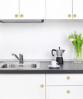 10 Pack Brushed Brass Kitchen Cabinet Knobs With Knurled Texture Gold Drawer Knobs on white cabinets in modern kitchen setup