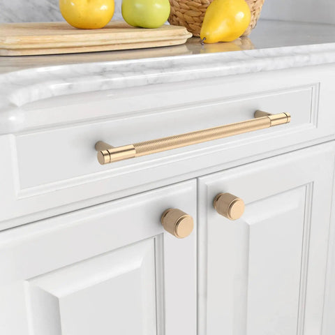 Ten Pack Of Seven Point Five Inch Antique Gold Cabinet Pulls Featuring Textured Knurled Grip Handles For Kitchen Cupboard Drawers on white cabinet
